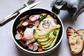 Asparagus, tomato and mushroom shakshuka with avocado and radish
