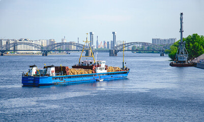 A dry cargo ship transports sawn timber along the Neva.