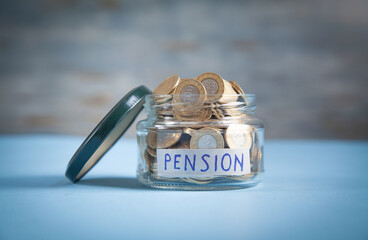 Coins in a glass jar. Pension