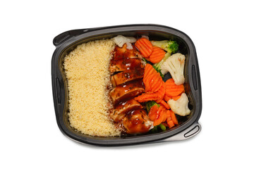 Ready food in a container. Stewed chicken in teriyaki sauce, stewed carrot, cabbage and porridge.