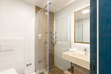 Interior of a luxury hotel bathroom with a shower cabin