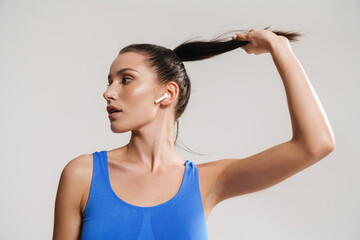 Fototapeta na wymiar Young white fitness woman in sportswear with ponytail