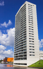 Modern skyscraper at the canal in historic city Groningen, Netherlands