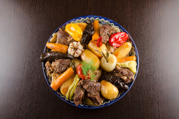 stewed vegetables with meat in a large plate, asian cuisine