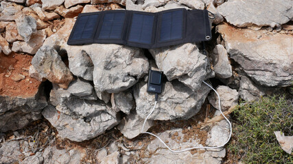 The solar panel charges the battery for the camera