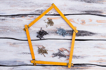 Shape of house and building materials.
