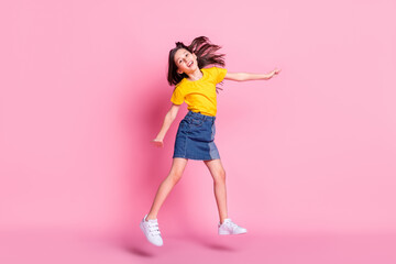 Fototapeta na wymiar Full lelngth photo of attractive nice happy llittle girl jump up good mood weekend isolated on pink color background