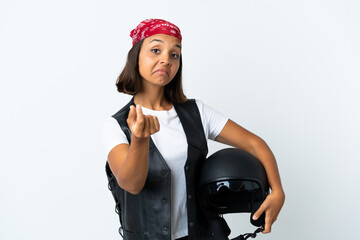 Young woman holding a motorcycle helmet isolated on white making money gesture