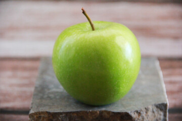 the fruit of a natural sweet green apple