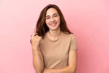 Obraz premium Young caucasian woman isolated on pink background laughing
