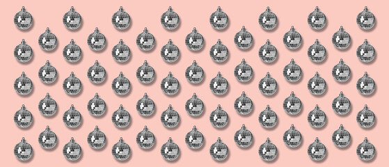Many shiny disco balls on pink background, flat lay. Banner design