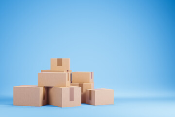 Group heap of cardboard boxes over blue background with copy space. Moving and shopping concept.