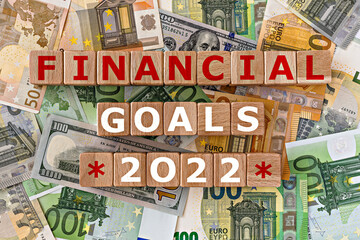 topview photo on financial goals theme.  wooden cubes with the inscription 