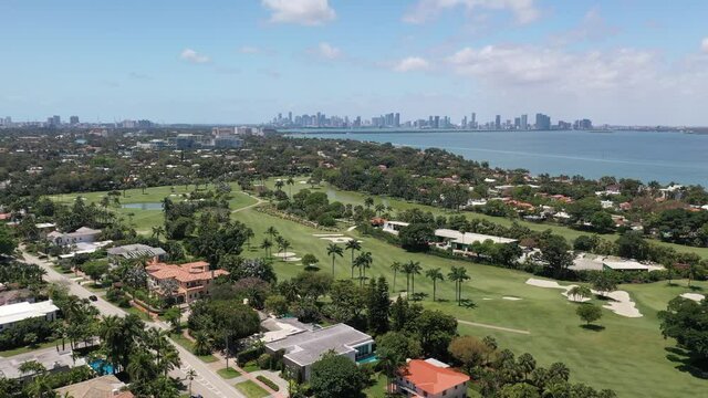 Drone Aerial Miami BeachPine tree Drive La Gorce Golf Course and Downtown Miami Skyline