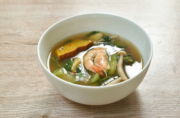 boiled mixed vegetable topping shrimp Thai spicy soup on bowl