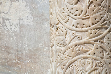 Inlaid marble column of a romanesque medieval Italian church (Tuscany - Pisa)