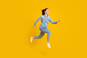 Fototapeta na wymiar Full size profile side photo of charming young nice woman look run jump up empty space isolated on yellow color background