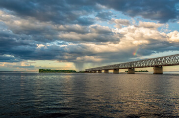 Fototapeta na wymiar Picturesque clouds above bridge across the Dnieper river, Cherkasy, Ukraine before the storm