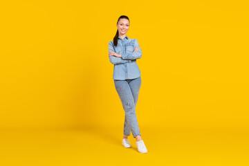 Fototapeta premium Full length body size photo woman smiling with crossed hands isolated vivid yellow color background