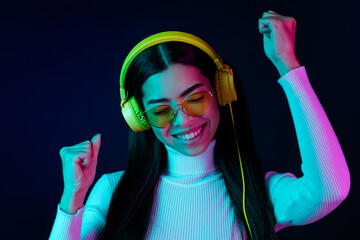 Photo of young girl happy positive smile have fun enjoy music dance party eraphones isolated over...