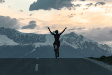 Fototapeta na wymiar Person riding bike at top of mountain