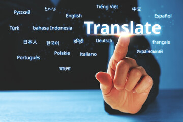 Person abstractly presses on the display with the word translate and foreign languages