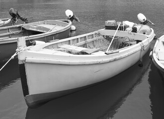 wooden fishing boat used by harbour worker in le grazie black and white photo