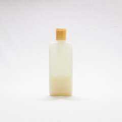 bottle of shampoo in a white background