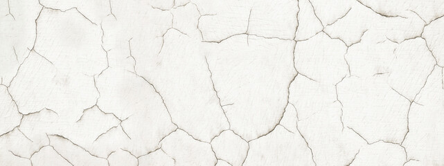 old distressed plaster wall with cracked paint texture