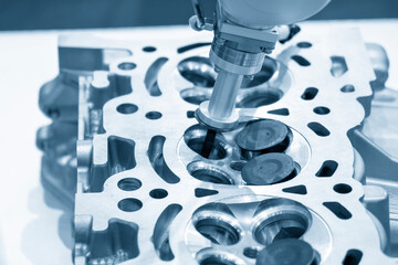 The cylinder head vale seat maintenance process by robotic system. The hi-technology automotive...