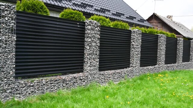 New build gabions fence. Gabion fence. 