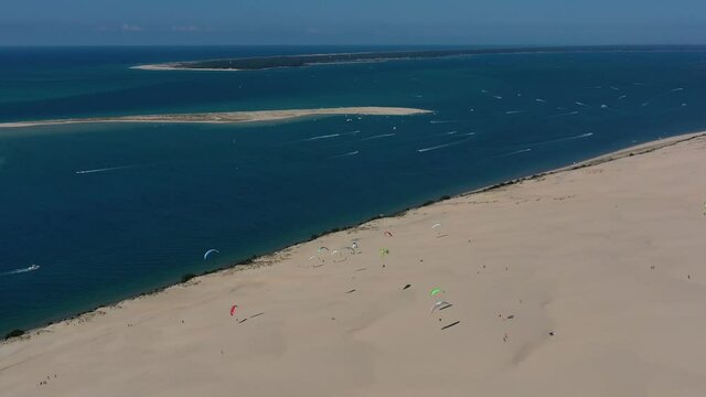  Paragliders fly over the Dune of Pilat Dune du Pilat , Arcachon, France. Largest sand dune in Europe.