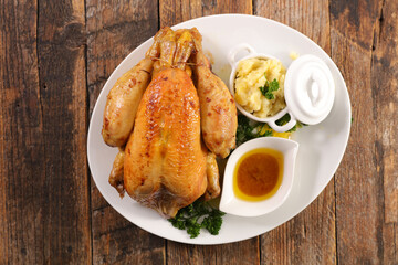 baked chicken with mashed potato and sauce