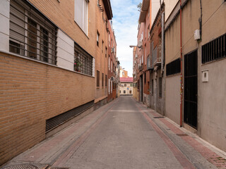 Fototapeta na wymiar POOR NEIGHBORHOOD IN SPAIN AREA STREET WITH CLOTHES AND GARBAGE