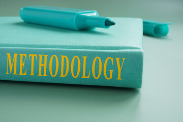 Book about methodology and marker on it. - obrazy, fototapety, plakaty