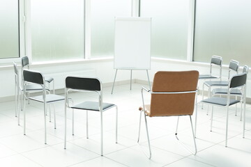 Flipchart and chairs in a bright office space
