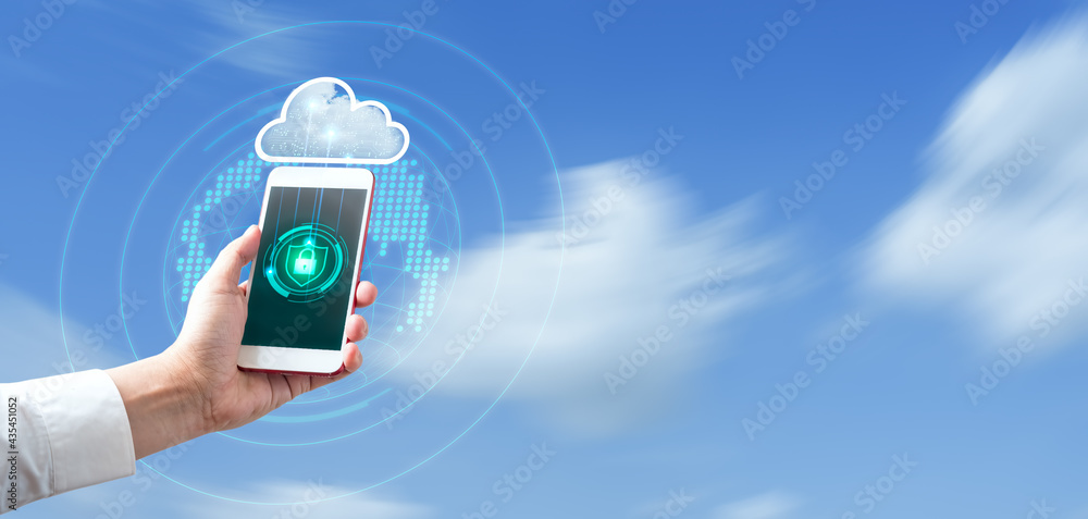 Aufkleber man's hand holding and using smartphone with blurred sky blue background. cloud security and data pr