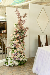 Beautiful floral compositions in the restaurant for the wedding ceremony