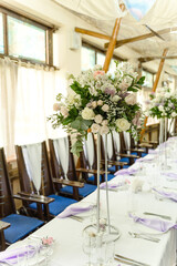 Beautiful floral compositions in the restaurant for the wedding ceremony