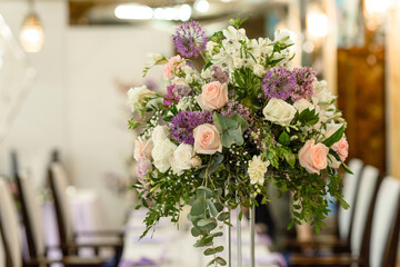 Beautiful floral compositions in the restaurant for the wedding ceremony