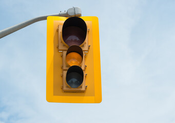 yellow traffic light on sky