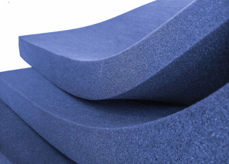 sheet of thick blue foam material on a white background