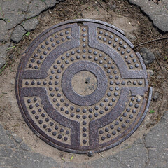 Fototapeta na wymiar manhole cover on the pavement