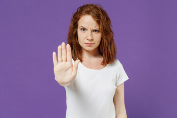 Young sad serious frowning strict caucasian woman 20s wearing white basic blank print design...