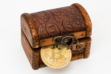 Bitcoin as digital currency laying in treasure chest