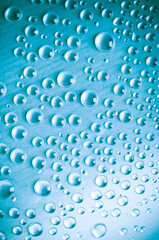 blue background with various drops of water 