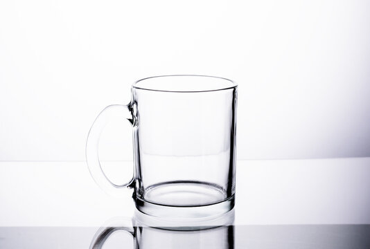 Empty glass to hold water, juice or milk, cocktails. It is home use Placed on a white table