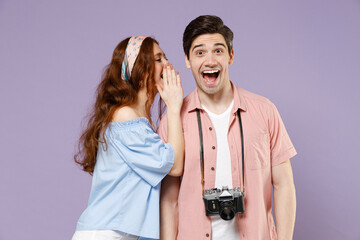 Two traveler tourist woman man couple in summer clothes friend whispering gossip and tells secret...