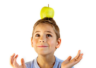 smiling boy with an apple on his head on a white background