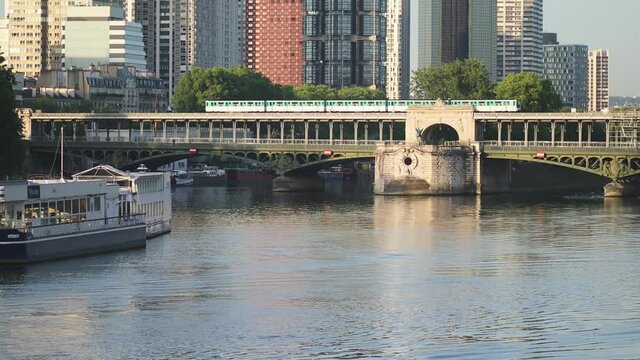 Parisian subway train groing on top of Bir-Hakeim bridge